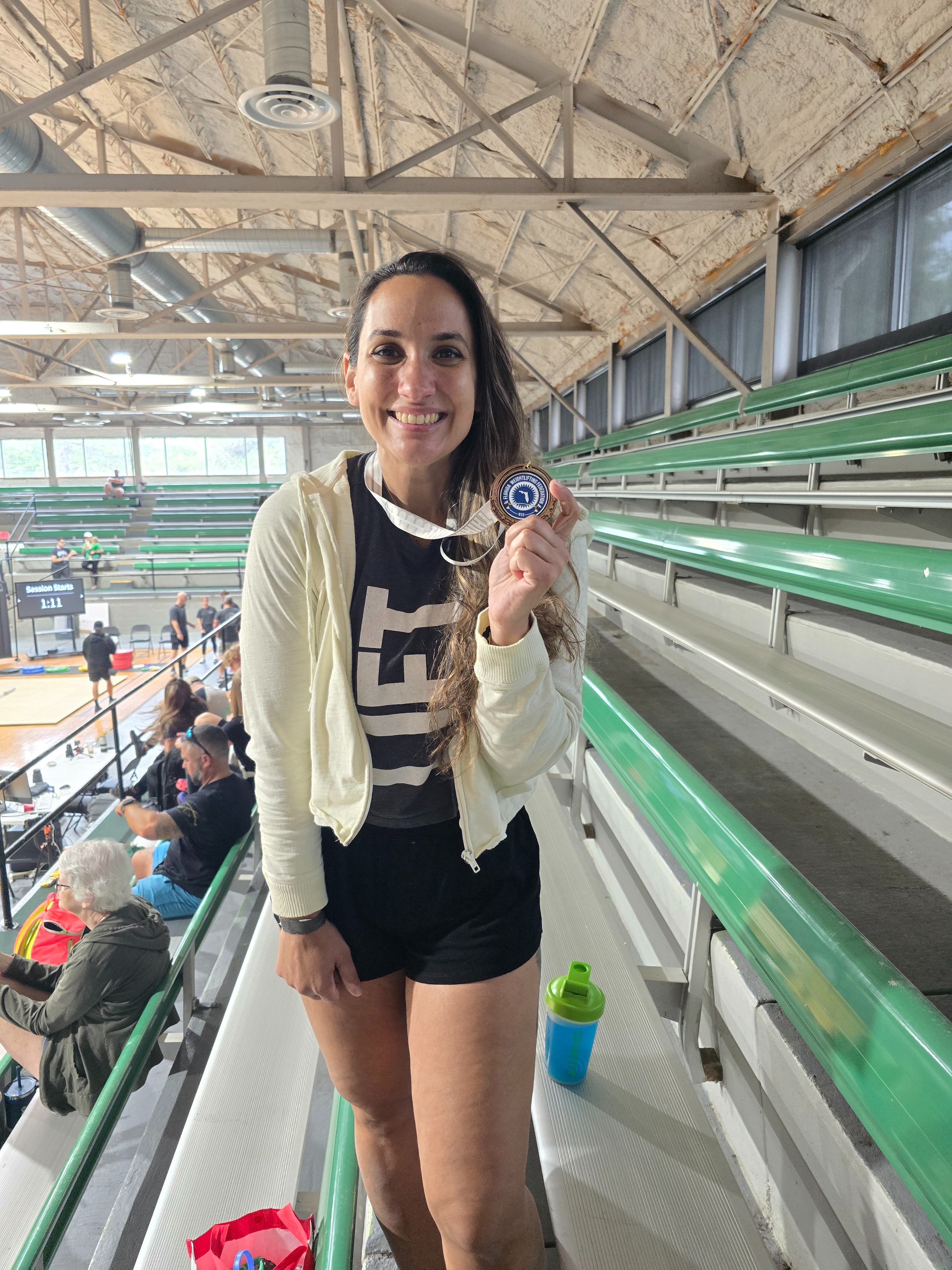 Yaz at competition holding medal